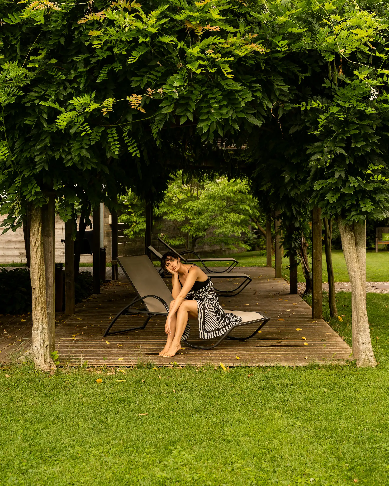 A woman relaxing in Theiner's Garten